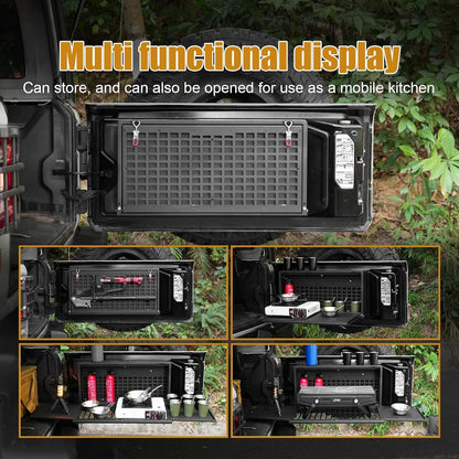 An outdoor product demonstration showing a black modular storage/travel system mounted on the side of a vehicle, with the main panel open and four smaller inset views showing different configurations and accessories. Large text at the top reads 'Multi functional display' and 'Can store, and can also be opened for use as a mobile kitchen.